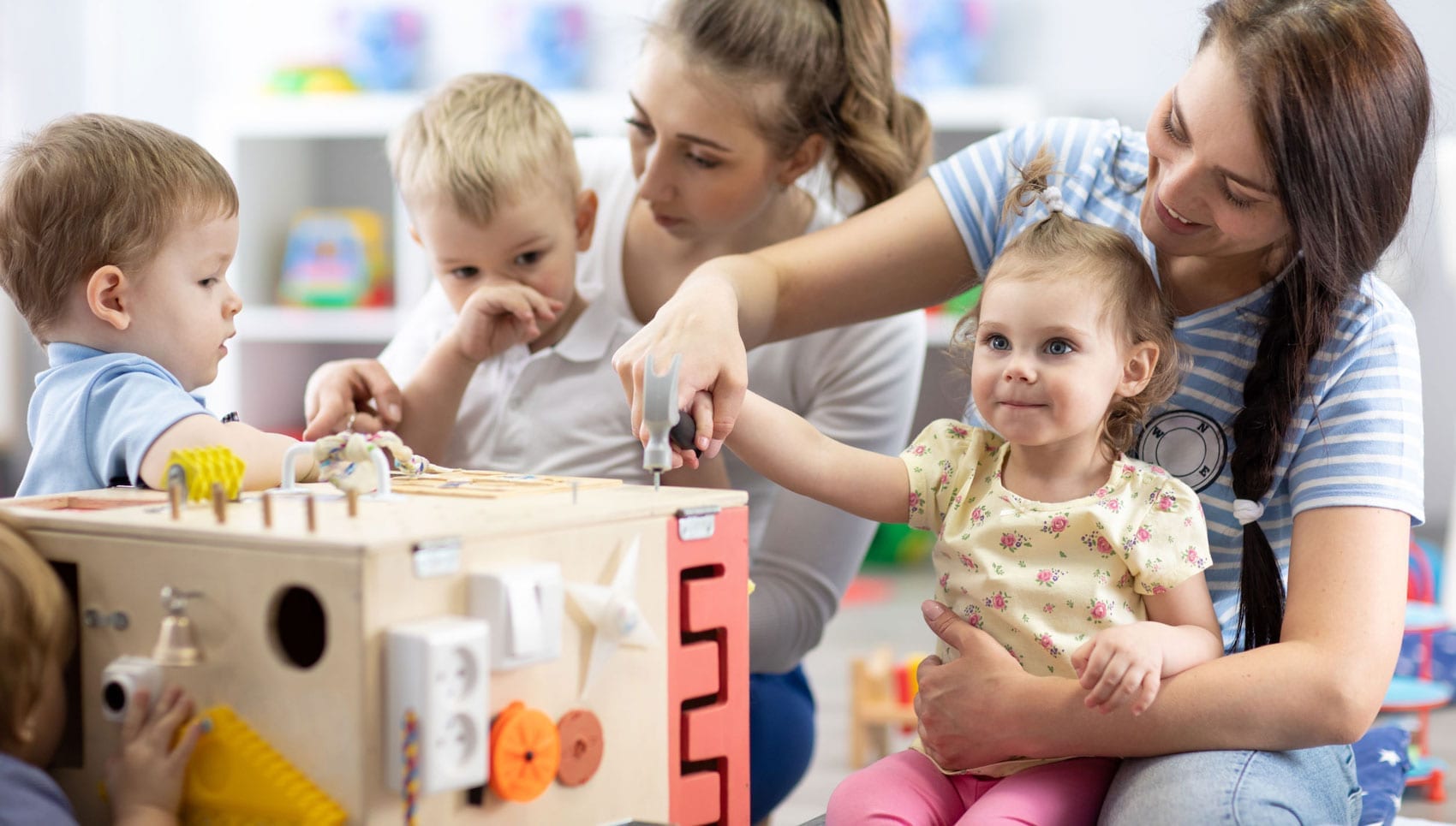 Young mothers and children playing